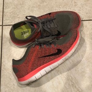 Women’s pink and gray Nike frees